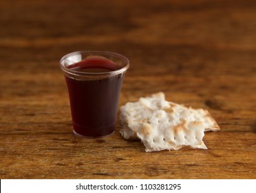 Christian Communion on a Wooden Table - Shutterstock ID 1103281295