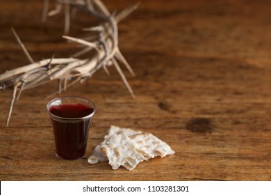 Christian Communion on a Wooden Table - Shutterstock ID 1103281301