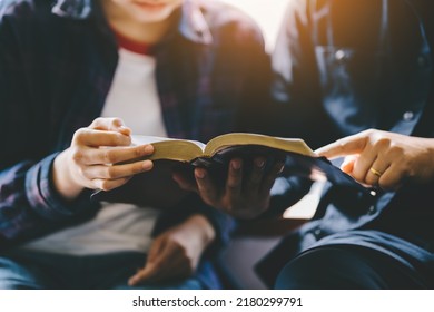 Christian Couple Or Group Reading Study The Bible Together And Pray At A Home Or Sunday School At Church. Concept Studying The Word Of God.