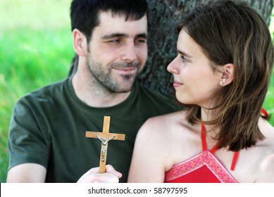 Christian Couple Is Praying In The Nature.