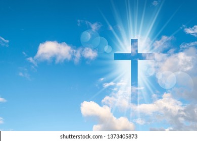 Christian cross appears bright in the sky background - Shutterstock ID 1373405873