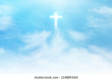 Christian cross appears bright in the sky background and soft clouds. with the light shining as Love. hope and freedom of God Jesus. - Shutterstock ID 2148893345