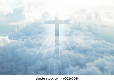 Christian cross appears bright in the sky background - Shutterstock ID 680260849