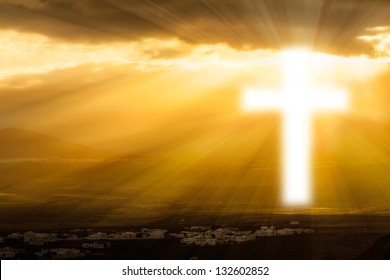 Christian Cross Glows Against The Rising Sun