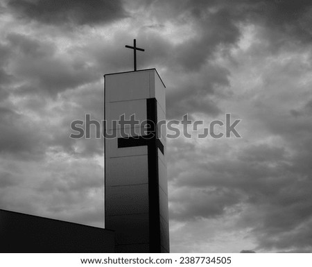 Christian cross. God church. Dramatic sky. Symbol of Christian is cross. Crucifix. Black and white photo.
