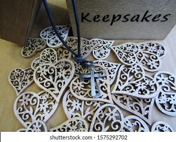 Christian Cross With Leather Cord, Decorative Wooden Hearts And Keepsakes Box. Still Life.