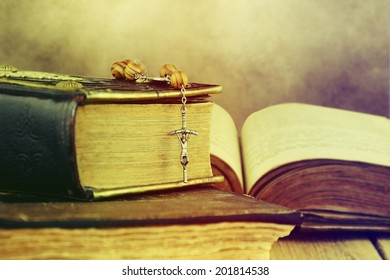  Christian Cross Necklace Next To Holy Bible.