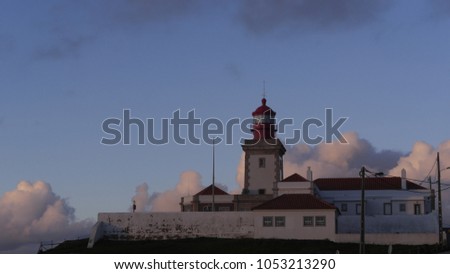 Christian Cross Obelisk at Cabo da Roca - Portugal - The western most extent of mainland Portugal, continental Europe and the Eurasian land mass. Sunset with clouds