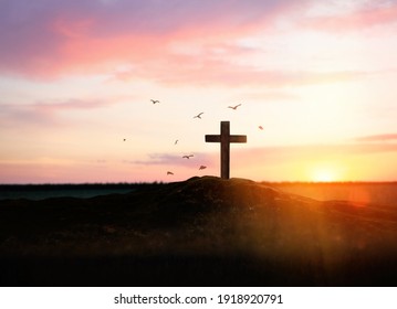 Christian cross on hill outdoors at sunset. Crucifixion Of Jesus