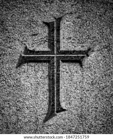 Christian cross on stone surface