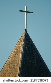 The Christian Cross On A Top Of A Church Spire.