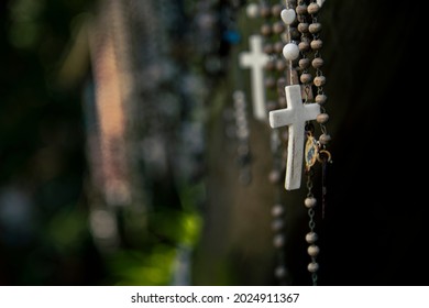 Christian Cross And Rosary Colorful Background.