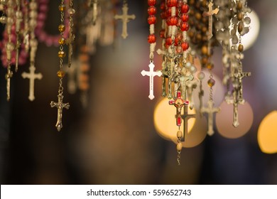 Christian Cross And Rosary Colorful Background.