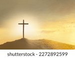 Christian Easter. Shining cross in clouds on golden sky. Ascension day concept. Faith in Jesus Christ. Christianity. Church worship, salvation concept. Gate to heaven. Eternal life of soul