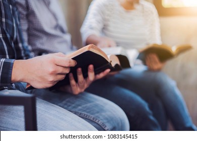 Christian friends group reading and study bible together in home or Sunday school at church with window light - Shutterstock ID 1083145415