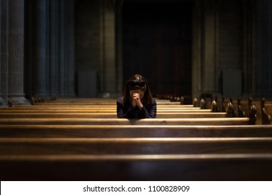 little girl praying in church