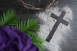 Christian Lent Background With Cross Of Ashes, Palm Leaves, Crown Of Thorns And Purple Cloth