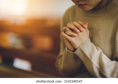 Christian life crisis prayer to god. Women Pray for god blessing to wishing have a better life. Hands praying to god with the bible. believe in goodness. Holding hands in prayer on a wooden table. - Shutterstock ID 2141540147