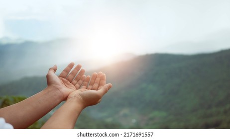 Christian man with open hands worship christian. Eucharist Therapy Bless God Helping Repent Catholic Easter Lent Mind Pray. Christian concept background. nature background.. - Shutterstock ID 2171691557