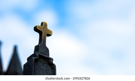 Christian Metal Cross On The Monument