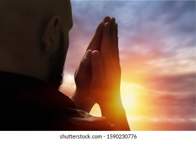 A Christian open palm hands on sky background