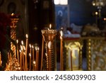 Christian Orthodox Church. Orthodox Church on the day of the Resurrection of Christ. Christianity. The church lit candles at icon. Burning candle. The inscription in Russian is CHRIST. Easter holiday