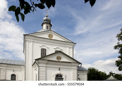 Christian orthodox white church with silver domes and gold crosses - Shutterstock ID 555579034