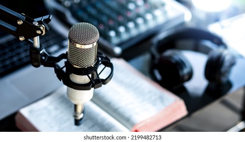 Christian podcast studio interior. preacher reads the bible online, records a podcast, online radio broadcast - Shutterstock ID 2199482713