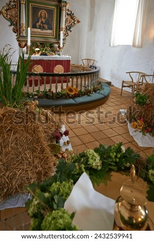 Christian, shrine or altar in church for religion, worship and spiritual festival or ceremony in Danish culture. Praise, god and painting of Jesus in chapel interior with flowers and holy decoration