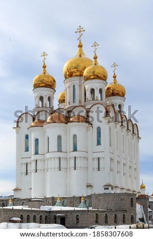 Christian temple. Beautiful large white building with golden domes and crosses. Russian Orthodox Church. Holy Trinity Cathedral, Magadan, Siberia, Far East of Russia.