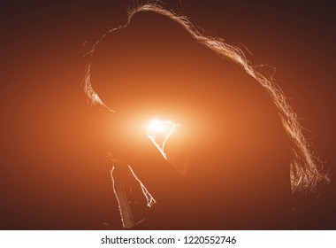 Christian Woman Praying In Church. Hands Crossed And Holy Bible On Wooden Desk. Background