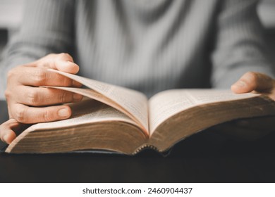 Christian woman reading bible in ancient Catholic temple. Devout Christian woman engages in prayer, fervently reading her Bible against religious background, embodying essence of Catholic devotion. - Powered by Shutterstock