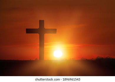 Christian Wooden Cross On Sunset Background.