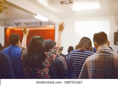 Christian Worship With Raised Hand At Church