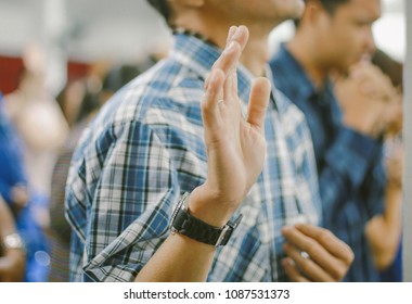 Christian Worship With Raised Hand At Church