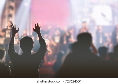 Christian worship with raised hand,music concert - Shutterstock ID 727624504