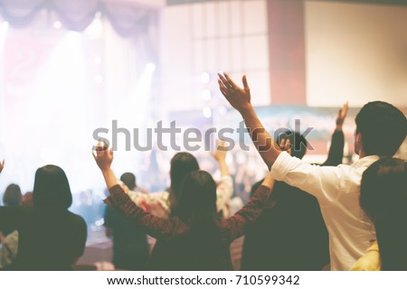 Christian worship with raised hand,music concert