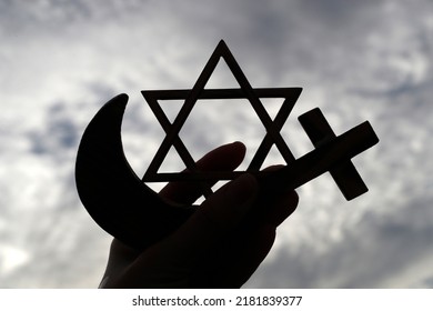 Christianity, Islam, Judaism  3  monotheistic religions. Jewish  Star, Cross and Crescent :  Interreligious symbols in hand. - Shutterstock ID 2181839377