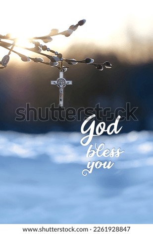 Christianity rosary cross on willow tree branch and text 