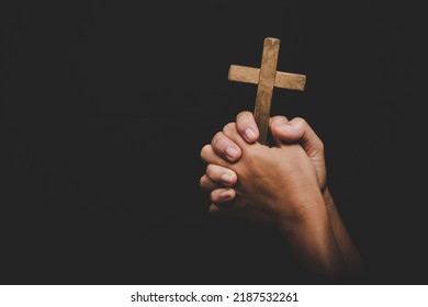 christianity woman catholic hand holding cross or crucifix pray to god, person prayer in church concept of religion, spirituality, religious, believe, , faith, hope, worship