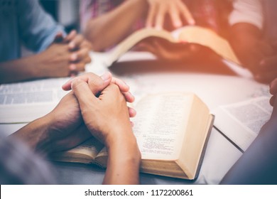 Christians Are Congregants Join Hands To Pray And Seek The Blessings Of God, The Holy Bible. They Were Reading The Bible And Sharing The Gospel With Copy Space.