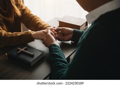 Christians are congregants join hands to pray and seek the blessings of God, the Holy Bible.Study the Word of God  - Shutterstock ID 2224230189