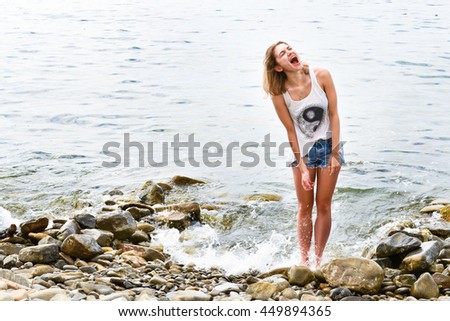 Similar – Young woman standing with closed eyes at the Baltic Sea beach