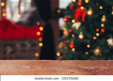 Christmas abstract background. Empty wooden table, horizontal surface in front of Xmas tree. New Year, light bokeh, celebration, holiday, party, copy space