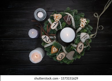 Christmas, Advent Table Wreath On A Dark, Wooden, Rustic Table With Four Candles Lit Up Decorated With Natural Ornaments, Nordic  Style, Home Decoration, Background