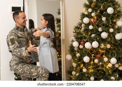 Christmas And Army. Veteran And His Daughter For Christmas