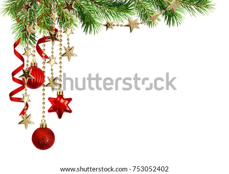 Christmas arrangement with green pine twigs, hanging red decorations and silk twisted ribbons isolated on white background