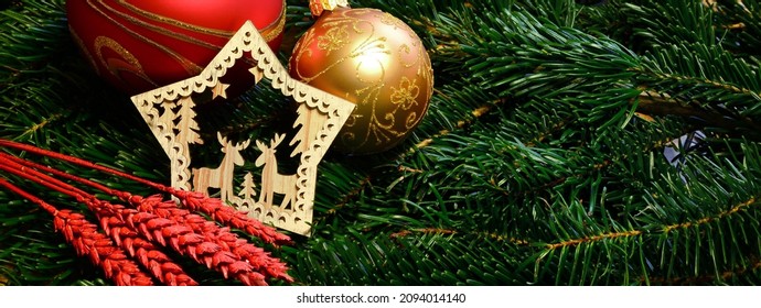 Christmas background banner with christmas spheres and decorations on fir branches