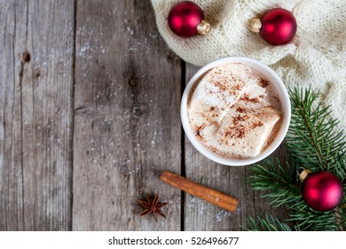 Christmas background with cup of christmas hot cocoa with marshmallow, top view