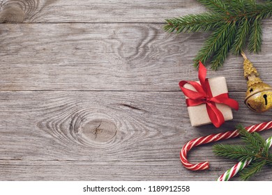 Christmas Background And Decorations On Right Side Of Wooden Table. Top View Of Holiday Card With Copy Space